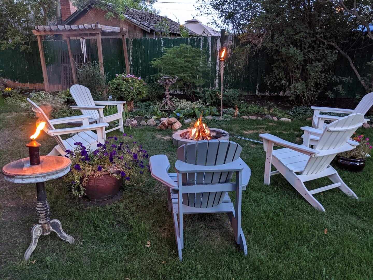 Backyard with chairs and campfire