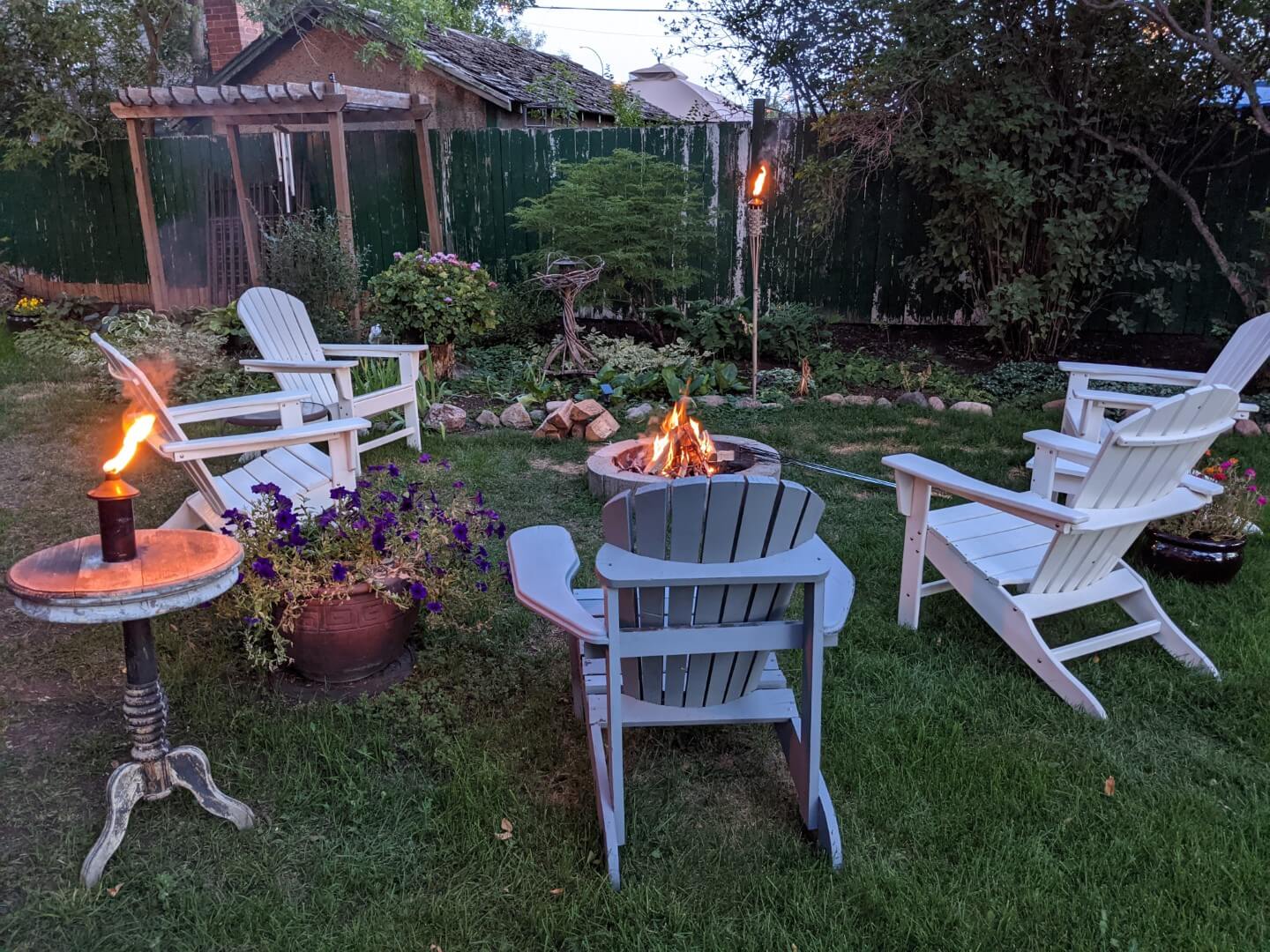 Backyard with chairs and campfire