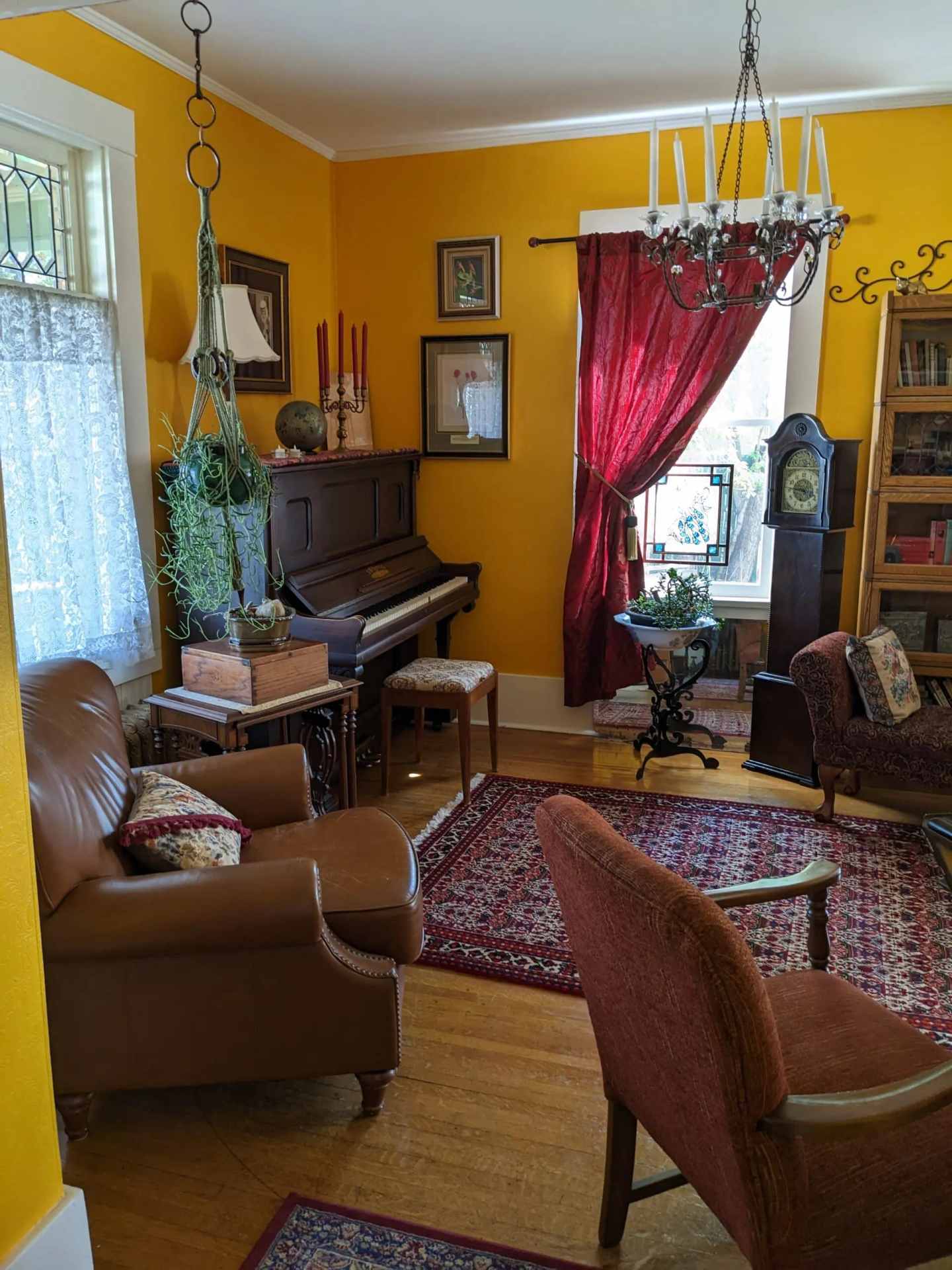 A room with piano on the corner